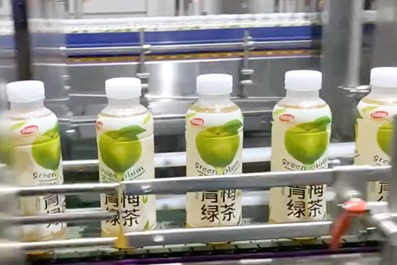 Solução de rotulagem termoencolhível para garrafas plásticas de chá verde para o Dali Foods Group